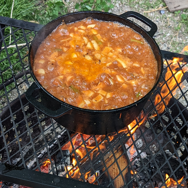 Beef stew over an open fire.