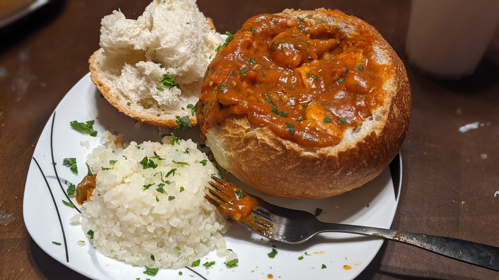 Cajun bread bowl with cauliflower rice.