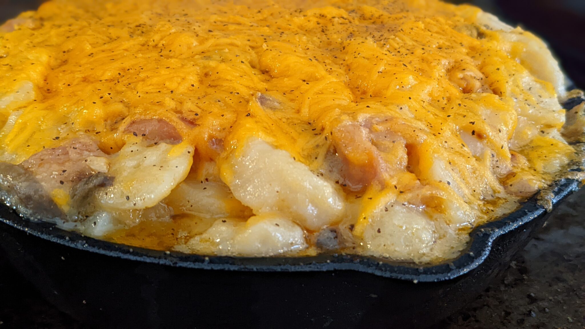 Cheesy potato bake close-up. Say cheese!